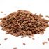 Closeup shot of flax seeds on a white surface A closeup shot of flax seeds on a white surface